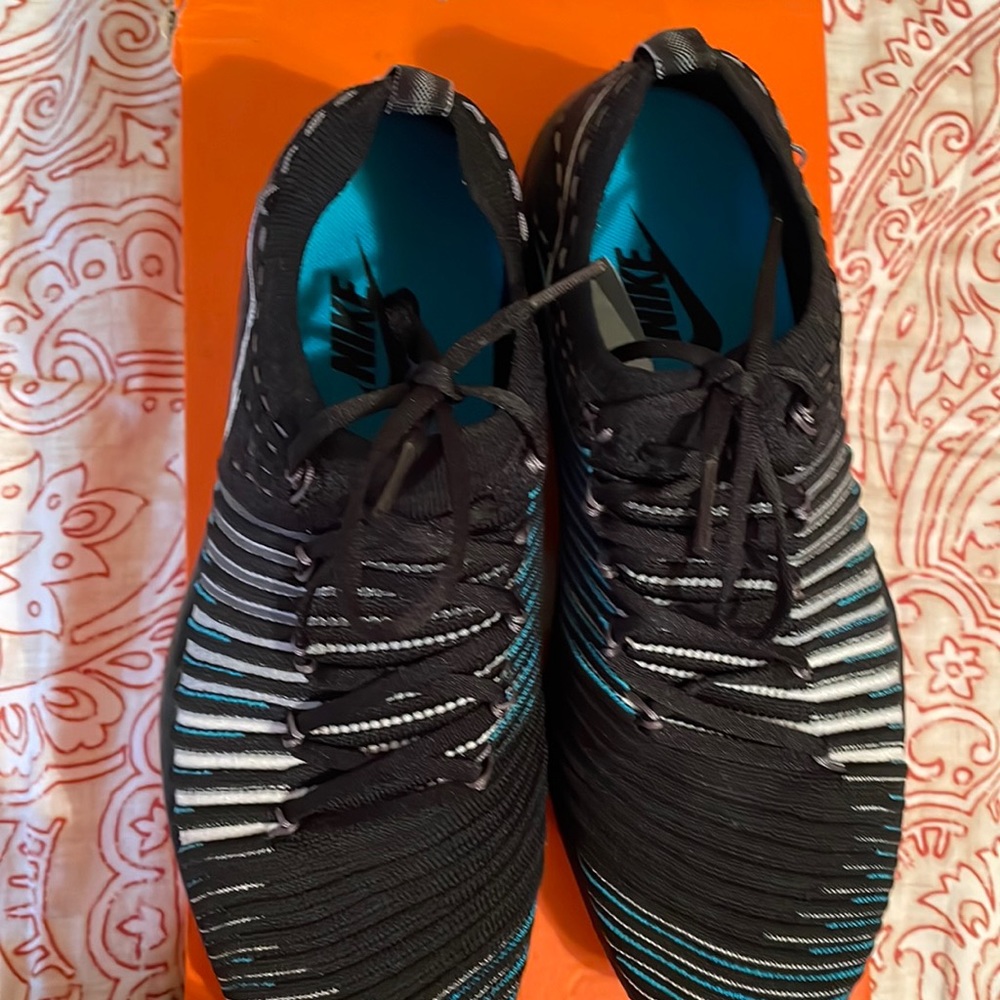 Women’s nike free transform fly knit size 7 worn  once black white wolf grey.
